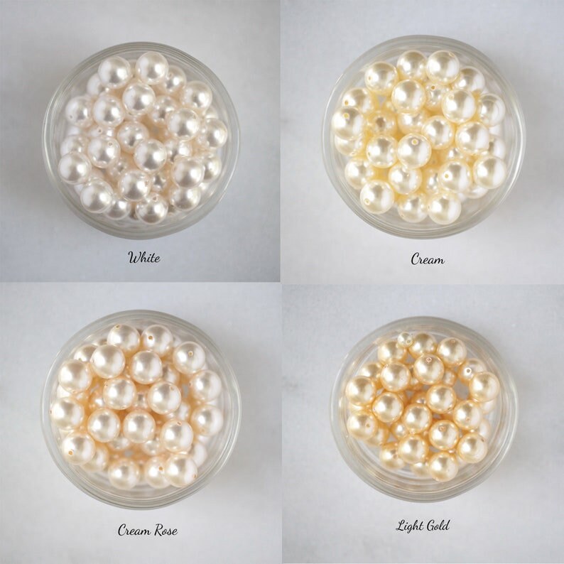 May include: Four bowls of pearl beads in different colors: white, cream, cream rose, and light gold.