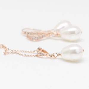May include: A set of rose gold earrings and a necklace with pearl accents and crystal embellishments.