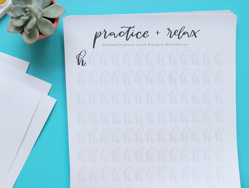 May include: A printable worksheet with the text "practice + relax" and "Worksheets for personal use only. Design by @TwoEasels.com". The worksheet features a large "h" at the top and a grid of smaller "h" letters for practicing calligraphy.