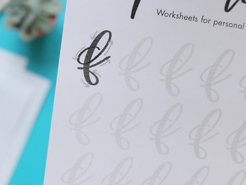 May include: A black and white worksheet with the letter 'f' written in cursive. The worksheet has multiple lines for practicing writing the letter 'f'.