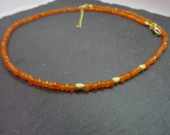 Necklace carnelian faceted with intermediate parts and carabiner made of 925 sterling silver, gold-plated, handmade, unique piece