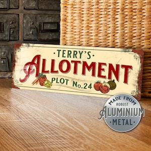 May include: A vintage-style metal sign with the text "Terry's Allotment Plot No. 24" in red and green lettering. The sign features a variety of vegetables and is made from robust aluminium metal.