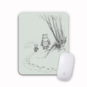 May include: A black and white illustration of Winnie the Pooh and Piglet walking through a forest. The illustration is on a light green background.