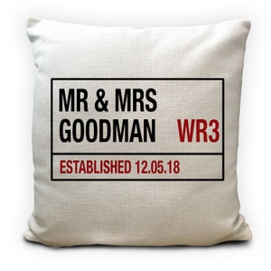 May include: White cushion with black text that reads "MR & MRS GOODMAN WR3 ESTABLISHED 12.05.18".