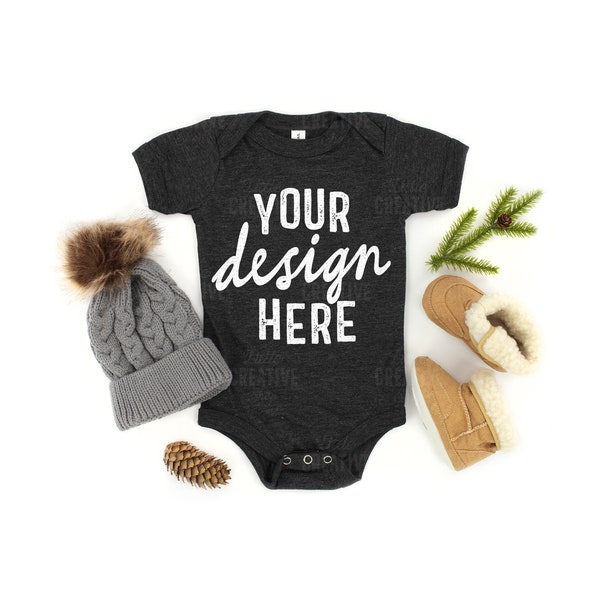 MOCKUP - Dark Grey Heather 100B Bella Canvas Baby Infant Bodysuit Christmas Winter Boots Hat Pine Cone Lay Flat Mock up JPEG