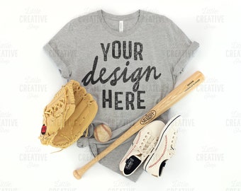 MOCKUP - Bella Canvas 3001 Athletic Heather Shirt Side Knot Flat Lay Mockup American Baseball Glove Bat, Shoes, Jeans White Background JPEG