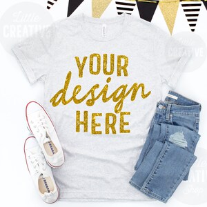 MOCKUP - Bella Canvas 3413 White Fleck Triblend Shirt Flat Lay Mockup Celebration New Years Pennant White Shoes on White Background