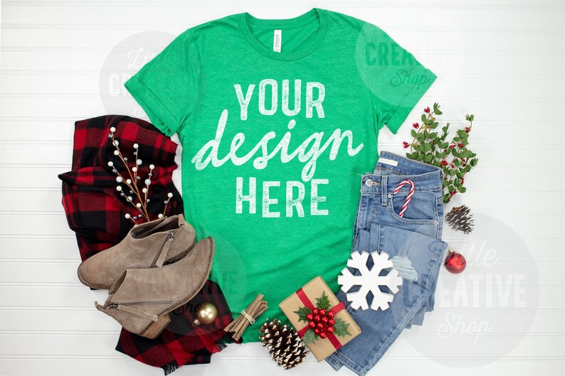 MOCKUP Bella Canvas 3001 Heather Green Shirt Christmas Plaid Holiday Elements T-Shirt Jeans Boots Lay Flat Mockup White Background image 1