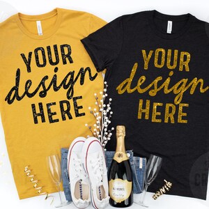 May include: Mustard yellow and black t-shirts with the text "YOUR design HERE" in a script font. The shirts are displayed with jeans, white sneakers, champagne, and glasses, with gold confetti.