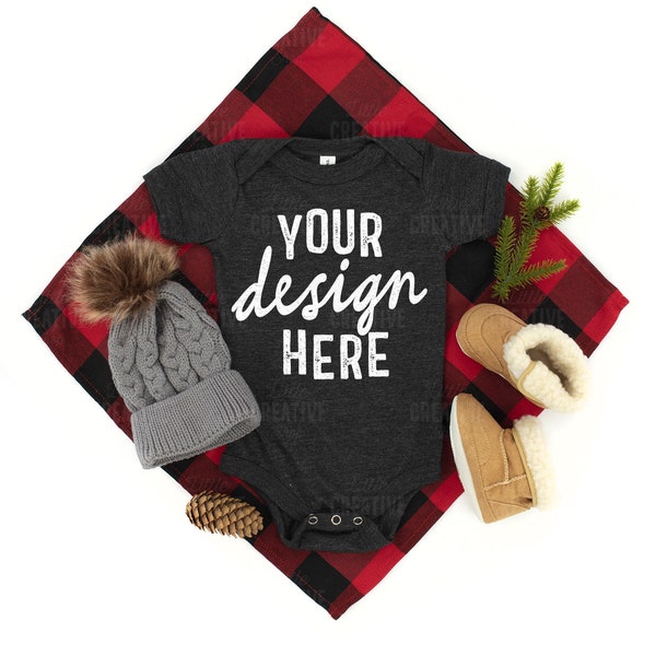 MOCKUP - Dark Grey Heather 100B Bella Canvas Baby Infant Bodysuit Christmas Winter Boots Hat Buffalo Check Pine Cone Lay Flat Mock up JPEG