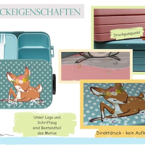 May include: A teal blue lunchbox with a white polka dot pattern and a deer illustration. The lunchbox has a removable top with a fork and three compartments. The text "DRUCKEIGENSCHAFTEN" is at the top of the image. The text "Unser Logo und Schriftzug sind Bestandteil des Motivs" is at the bottom left of the image. The text "Druckgusspunkt" is on the top right of the image. The text "Direktdruck - kein Aufkleber" is at the bottom right of the image.