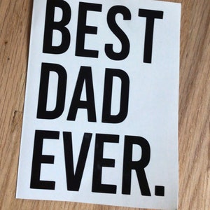 May include: White card with black text that reads "BEST DAD EVER."