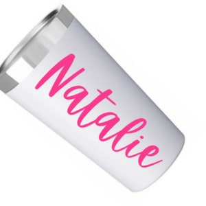 May include: White stainless steel tumbler with a pink vinyl decal that says "Natalie".