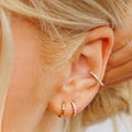 Huggie Hoop Earrings • gold conch hoop • cartilage hoop • hoop earrings • silver pave ring hoop • tragus hoop • small helix hoop product logo