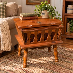 May include: A medium-brown wooden side table featuring a hinged lid top and a lower storage compartment with a spindle-style railing. The table stands on four turned legs and is constructed from wood with a visible grain and warm finish.