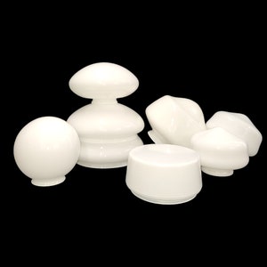 May include: A set of six white glass lampshades in various shapes and sizes. The lampshades are all made of a smooth, opaque glass and have a classic, elegant design.