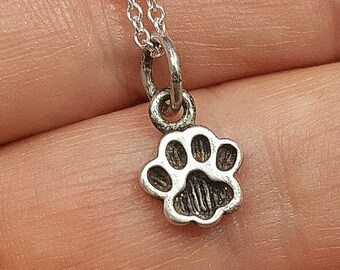 Tiny Paw Print necklace. Sterling silver tiny paw print charm. Dog paw print necklace. Cat paw print necklace. Pet memorial. Pet jewelry.