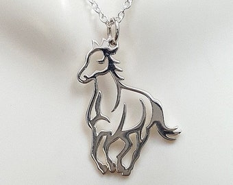 May include: A silver necklace with a delicate cutout horse pendant. The horse is facing forward with its head held high.