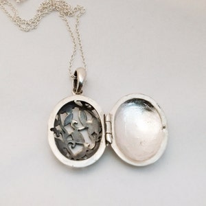 Sterling Silver Keepsake Locket. Oval Engraved Filigree Locket. Photo ...