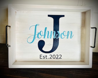 May include: White wooden tray with black handles. The tray has a blue and black vinyl design with the last name "Johnson" and the text "Est. 2022".