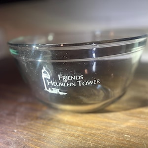 May include: A clear glass mixing bowl with the text "Friends of Heublein Tower" printed on the side.