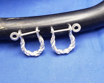 May include: A pair of silver-toned U-shaped earrings featuring a twisted rope texture. Each earring includes a straight threaded post with a circular screw-on backing, designed to secure the piece through a small opening at the top.