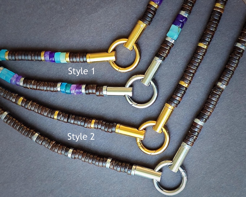May include: Three necklaces with brown wooden beads, gold and silver accents, and turquoise and purple gemstones. The necklaces are labeled "Style 1" and "Style 2".