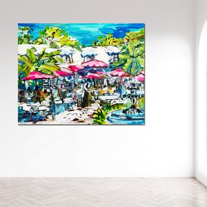 May include: A colorful painting of an outdoor cafe scene with pink umbrellas, tables, and chairs. The cafe is surrounded by lush greenery and a fountain. The painting is done in a loose, expressive style.