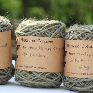 May include: Three skeins of handspun Cheviot yarn dyed with nettles. Each skein is labeled "Highland Colours" and includes the weight (25g) and website address.