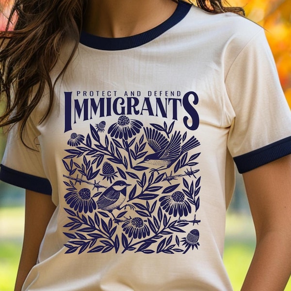Camiseta unisex de algodón con cuello redondo "Protect & Defend Immigrants"