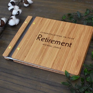 Custom wooden retirement guest book, personalized with the employees name and congratulatory message engraved on the cover.