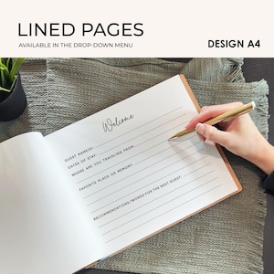 a lined guestbook with a person's hand writing on it, with a pen visible. The text on the guestbook appears to be a welcome message for the next guest.