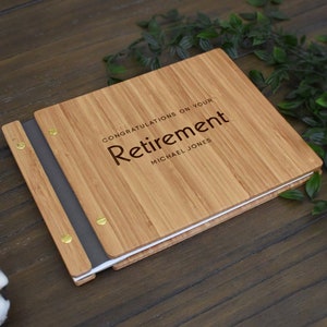 Personalized bamboo retirement guest book, with vegan leather binding an amber finish, customized with the employees name engraved on the cover.