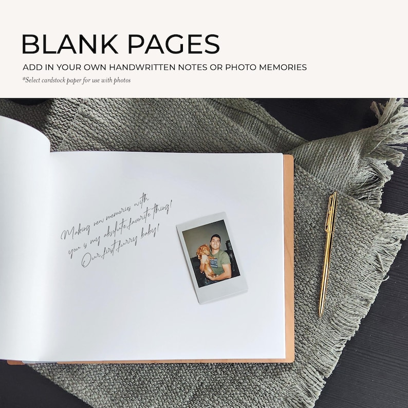 a blank book with a handwritten note and a small Polaroid photo of a couple, along with a pen and a gray blanket on a wooden surface.