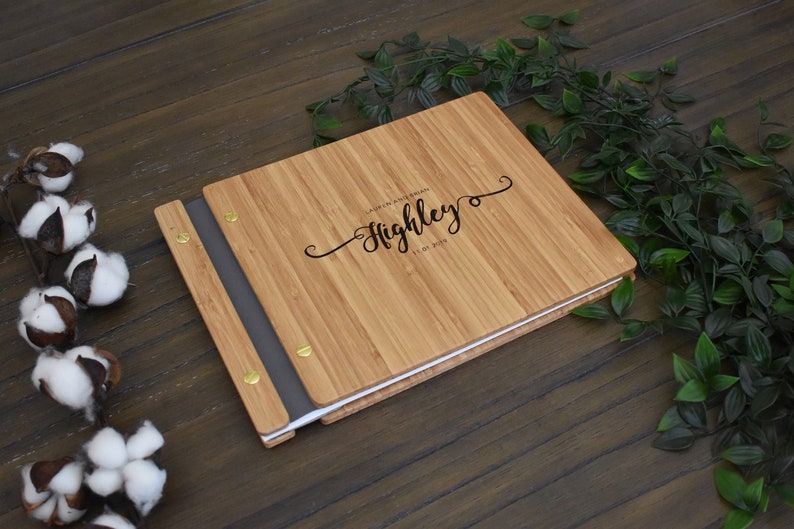Personalized bamboo first wedding anniversary album in an amber finish, customized with a loving message and the anniversary date engraved on the cover.