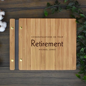 Retirement bamboo guest book, personalized with congratulations message and employees name engraved on the cover.