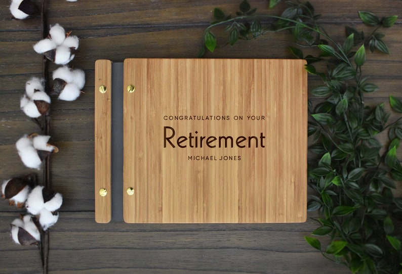 Retirement bamboo guest book, personalized with congratulations message and employees name engraved on the cover.