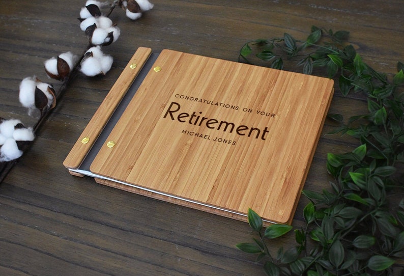 Custom wooden retirement guest book, personalized with the employees name and congratulatory message engraved on the cover.