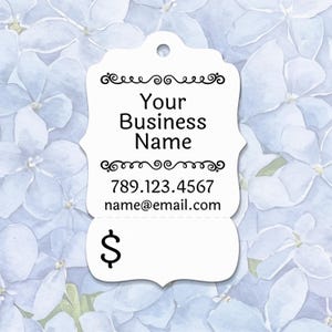May include: A white, decorative tag with a scalloped bottom and a hole at the top. The tag features the text "Your Business Name", a phone number, and an email address. The bottom of the tag has a dollar sign.