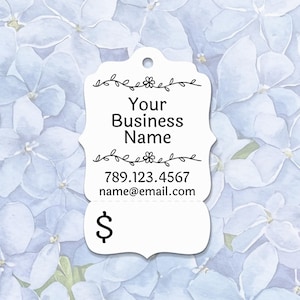 May include: A white tag with a decorative border and the text "Your Business Name", phone number, and email address. The tag also includes a dollar sign. The background features a pattern of blue flowers.