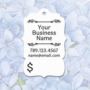 May include: A white tag with the text "Your Business Name", a phone number, and an email address. The tag has decorative flourishes and a dollar sign at the bottom. The background is a watercolor floral pattern.