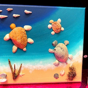 May include: A white ceramic mug with a black handle and the text "But First, Coffee" in a bold, black font. The mug is set against a blurred background, suggesting a cozy setting.