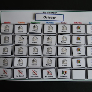 May include: A white calendar with a blue title bar that says "My Calendar October". The calendar has days of the week listed across the top and rows of small squares with icons representing activities. The icons include a house for "Home", a school building for "School", and a red diagonal line through a school building for "No School". There is also a square with a witch and a pumpkin for "Halloween".
