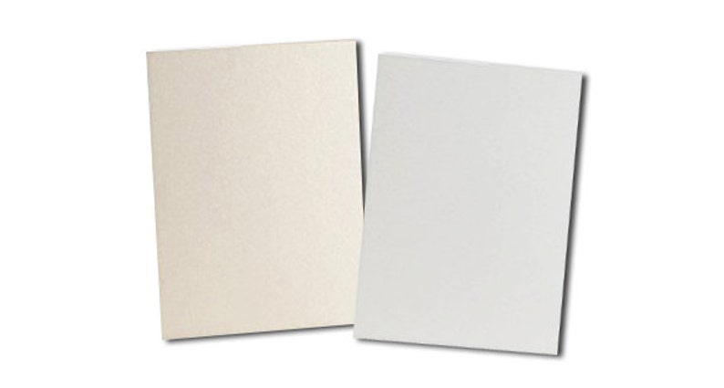 May include: Two sheets of paper, one white and one off-white, with a textured surface.