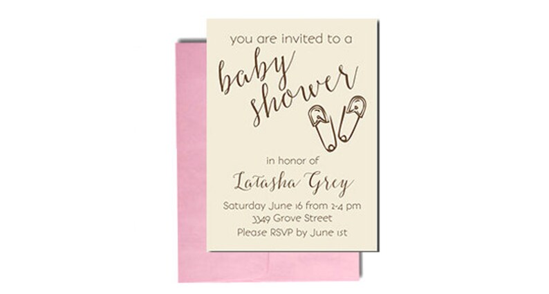May include: A cream-colored baby shower invitation with a pink envelope. The invitation features a handwritten script that says "you are invited to a baby shower" with a pair of safety pins drawn above the text. The invitation also includes the name "Latasha Grey" and the details of the shower: "Saturday June 16 from 2-4 pm, 3349 Grove Street, Please RSVP by June 1st."