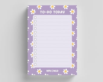 May include: A purple notepad with a white daisy pattern and the text "TO-DO TODAY" at the top. The notepad has a checklist with blank lines and a small logo at the bottom that says "INKY in the WILD".