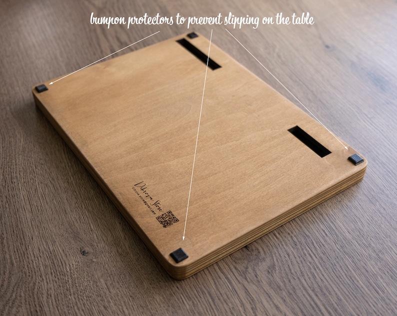 May include: A wooden board with black rubber bumpers on the bottom to prevent slipping on a table. The board has a laser-engraved logo that says "Urban Jive" and a website address.