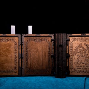May include: A three-panel wooden screen with dark brown frames and light brown center panels. The panels feature intricate engraved borders. The right panel displays an engraved dragon, a large diamond, dice, and the text DO OR DO NOT, THERE IS NO TRY.