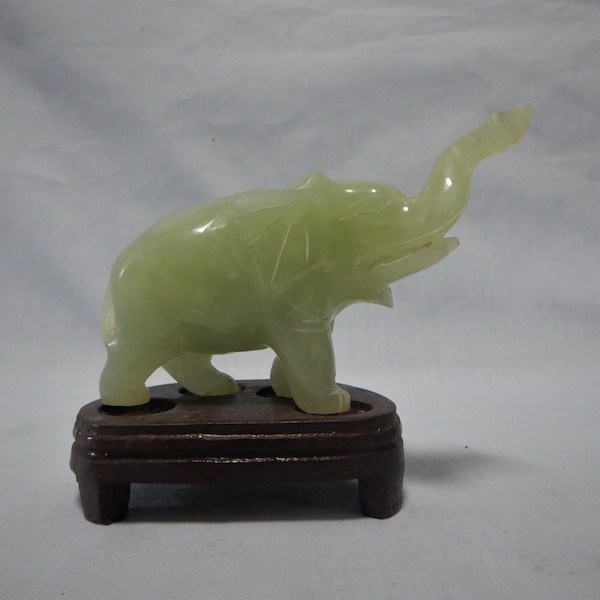 Vintage Chinese nephrite xui jade elephant hand carved wood stand circa: late 20th Century