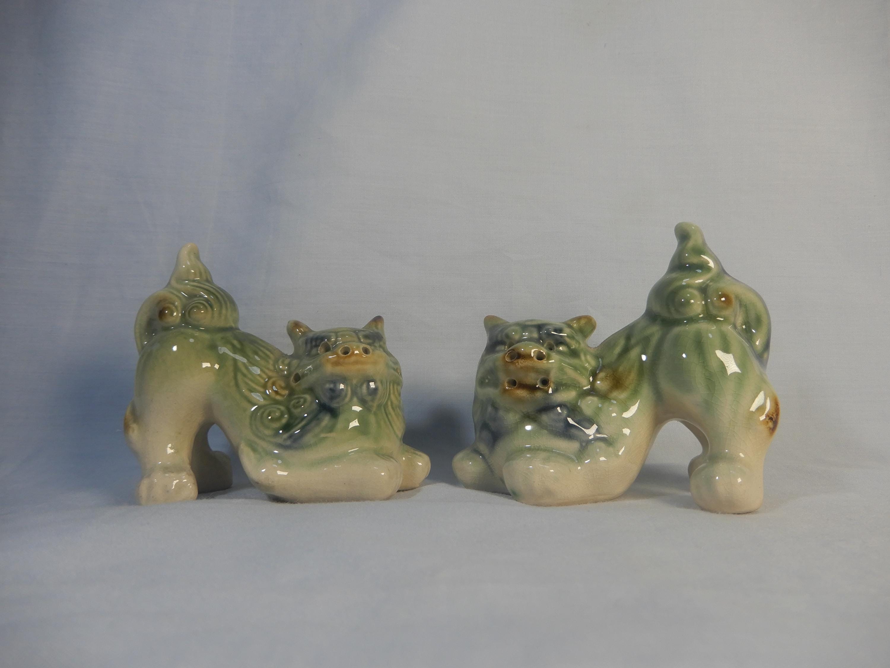 Vintage porcelain foo dogs pair circa mid 20th Century retired unused from old stock